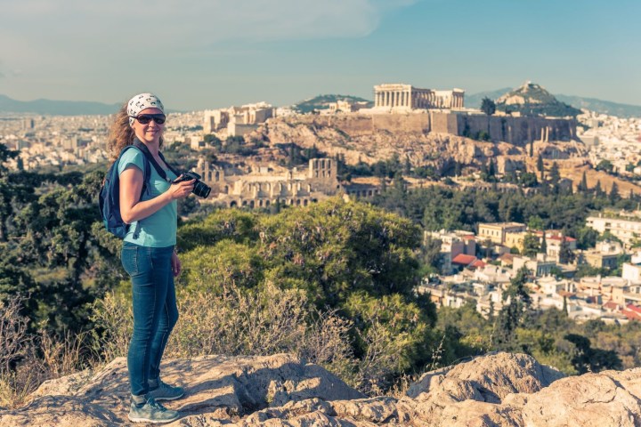 a person standing in front of a mountain